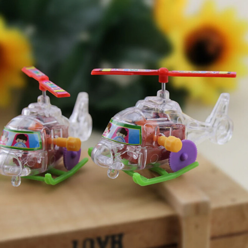 New 2Pcs Mini Clockwork Transparent Aircraft Somersault Running Wind Up Toy