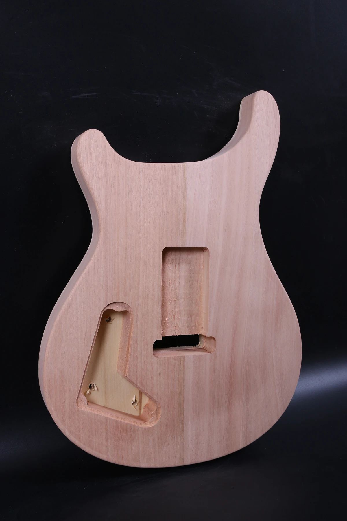 one unfinished electric guitar body