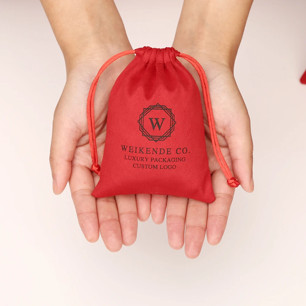 100 stuks Rose gepersonaliseerd logo sieraden tasje fluwelen verpakking zakjes chique bruiloft gunst zakken roze flanel cosmetische zak