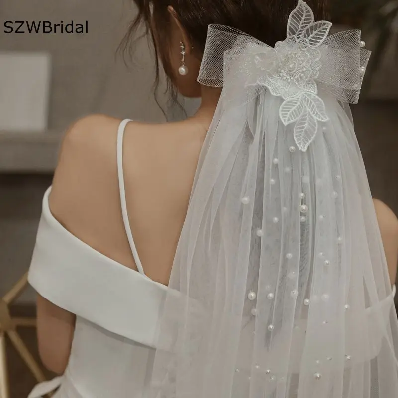 ใหม่มาถึง Welon Ivory Wedding Veils ลูกปัดไข่มุกโบว์หวีสั้นผ้าคลุมหน้าเจ้าสาว Casamento งานแต่งงาน accesorios de la boda