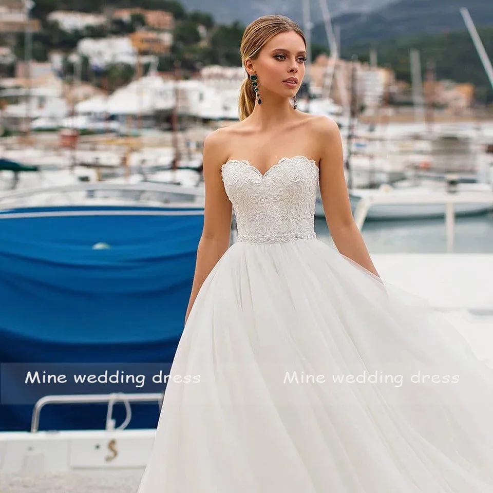 

Customized Sweetheart Lace Applique Beads Belt Princess Tulle Wedding Dress A-Line Backless Corset Designs Wedding Gowns