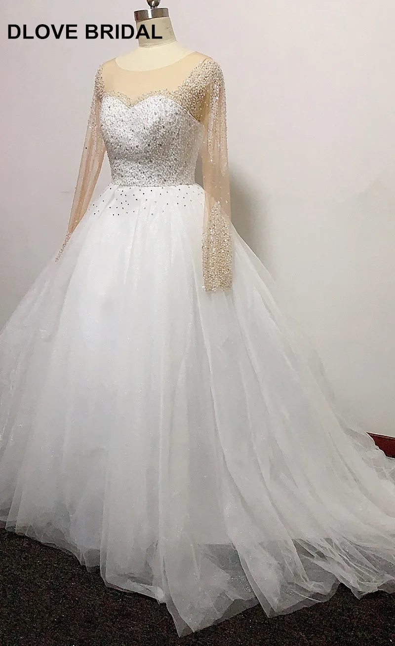 Robe de mariée luxueuse pour le bal à couches à manches longues avec jupe lourde et perlée, scintillante, sur mesure