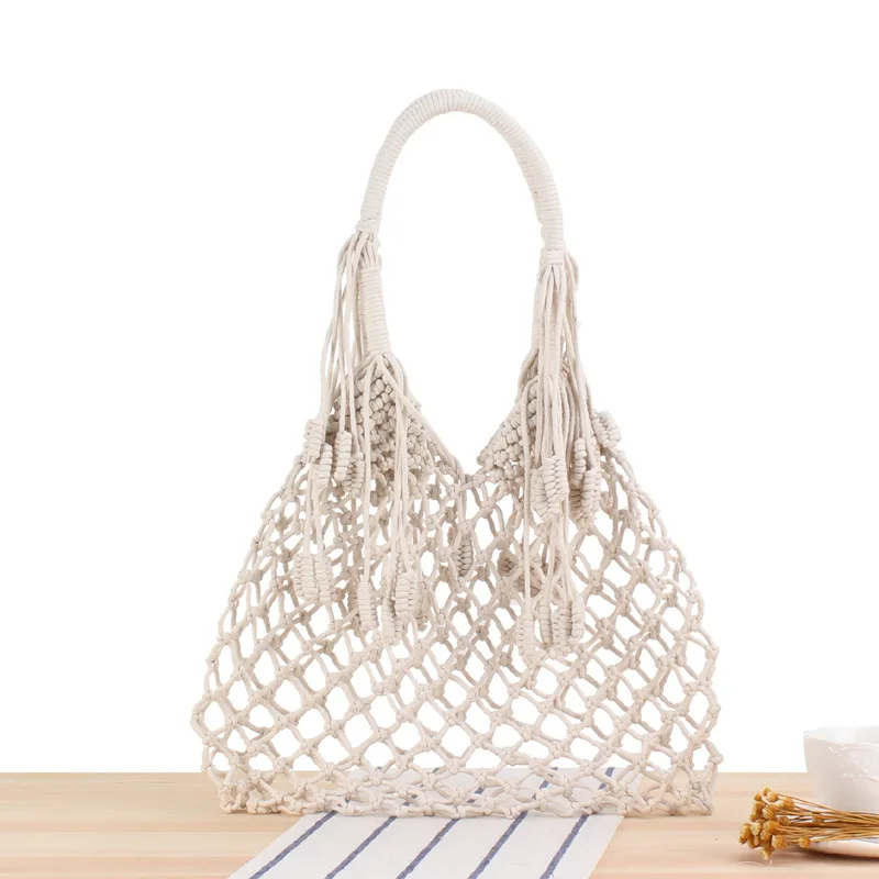 Ins Tassel Shoulder Woven Trendy Female Straw Beach Bag Degrees Handmade Cotton String Net Pocket Handbags Luxury Designer