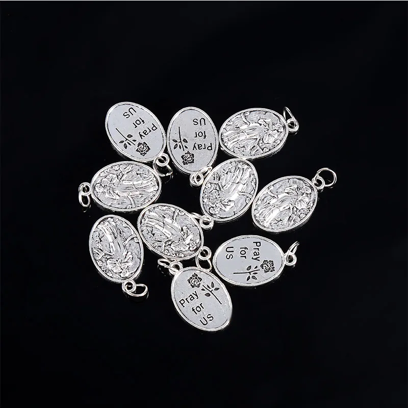 A variety of religious Christ small pendants, Lourdes small pendants, Saint Francis small pendants, Saint Michael small pendants