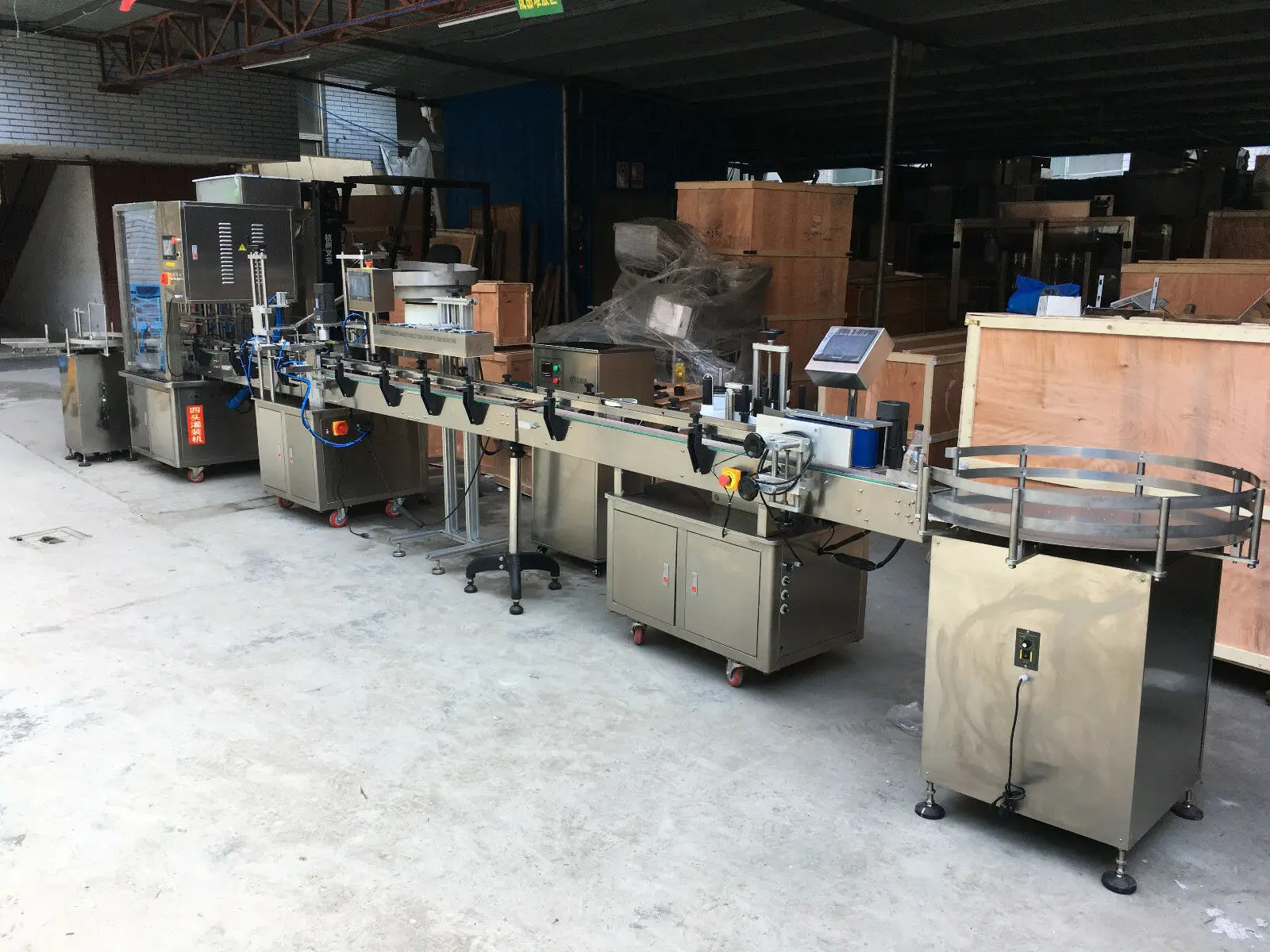 Automatic Liquid Filling Pluging Capping Labeling Machine with Bottle feeders By Sea