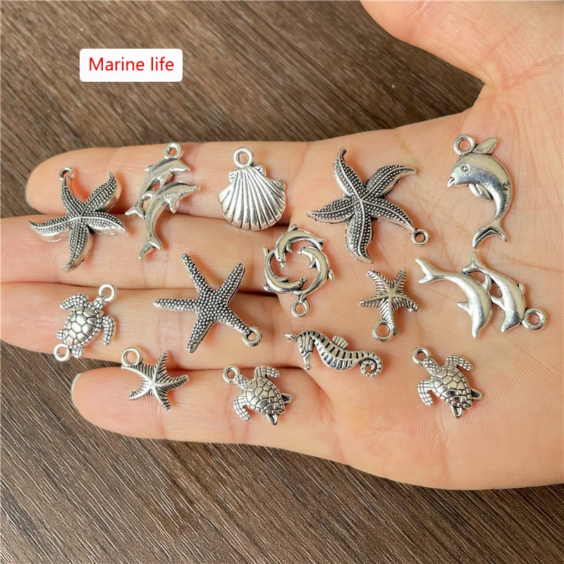 JunKang 180pcs random mixed batch of peach heart leaf animal palm moon star ocean series pendant DIY bracelet necklace making