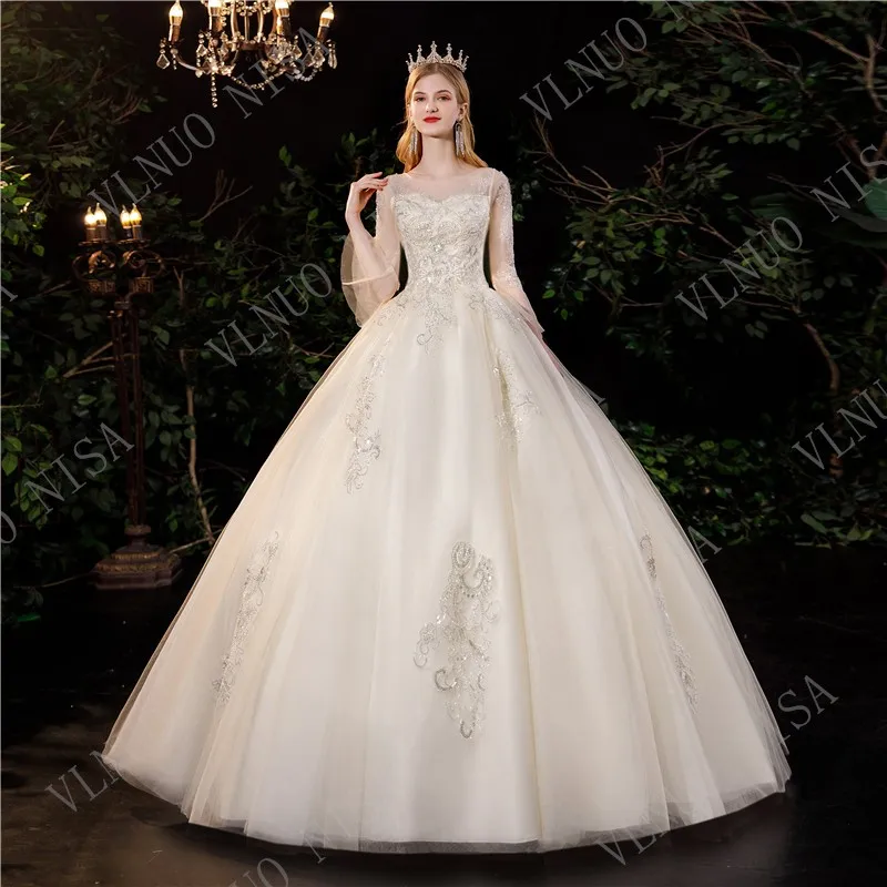 

Vlnuo Nisa Sequined O Neck Muslin Wedding Dresses With Long Sleeve Lace Up Floor Length Plus Size Bride Gowns Bridal Dresses