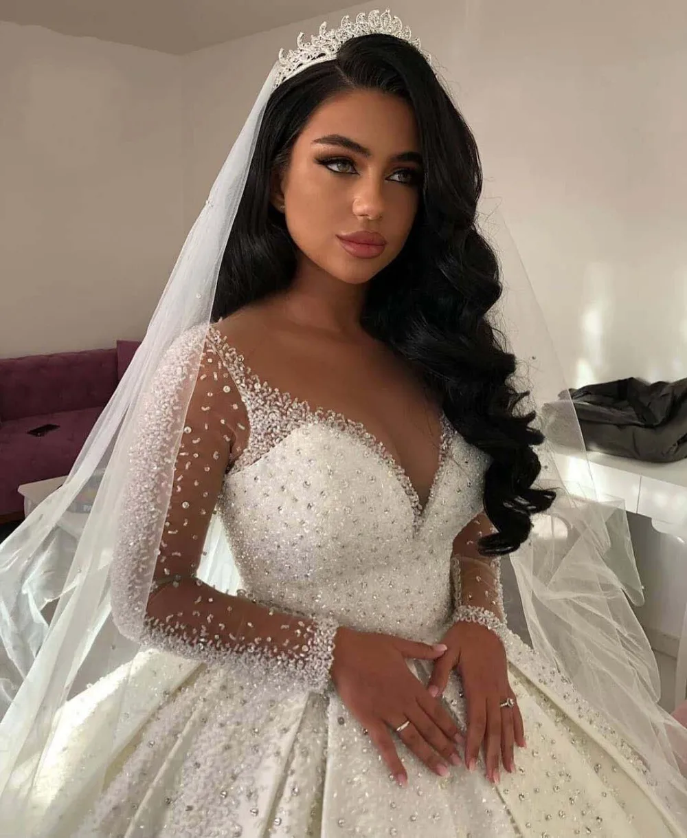 

2025 Luxury Wedding Dresses V Neck Beaded Bling Sheer Long Sleeve Satin Floor Length Puffy Bridal Gowns Mairee Handmade