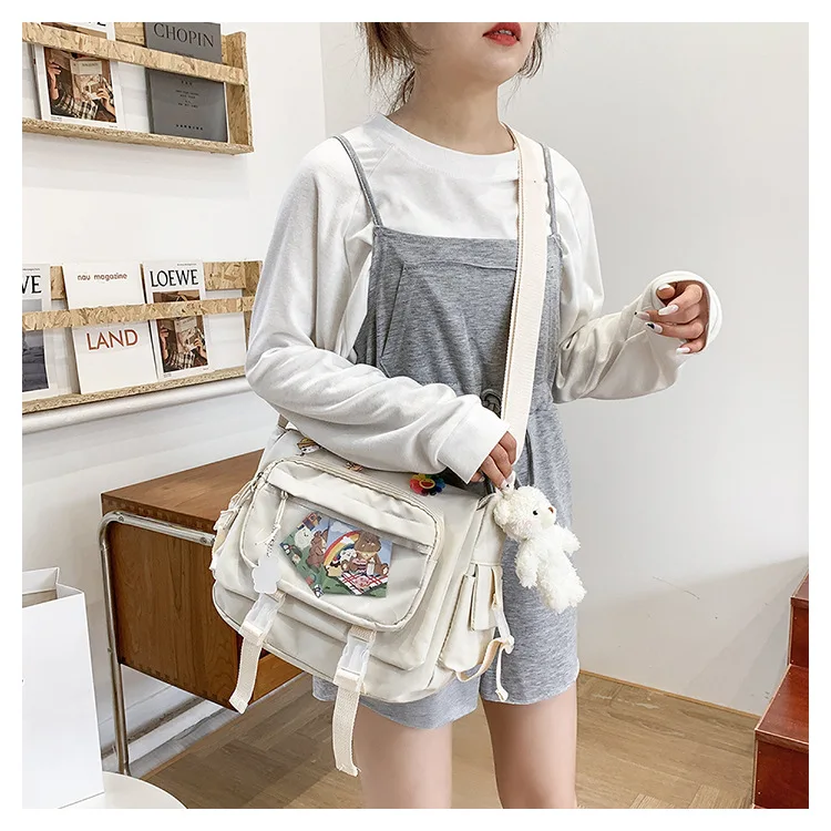 Bolso de mensajero con bolsillo transparente para mujer, bandolera bonita con insignia de dibujos animados, estilo Kawaii para estudiantes