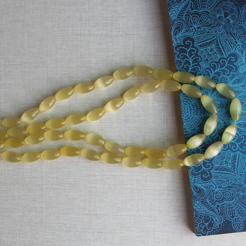 Cuentas de cristal de ojo de gato con forma de arroz, tamaño de agujero de 1,2mm, 25 piezas por lote, precio de fábrica, alrededor de 8x15mm