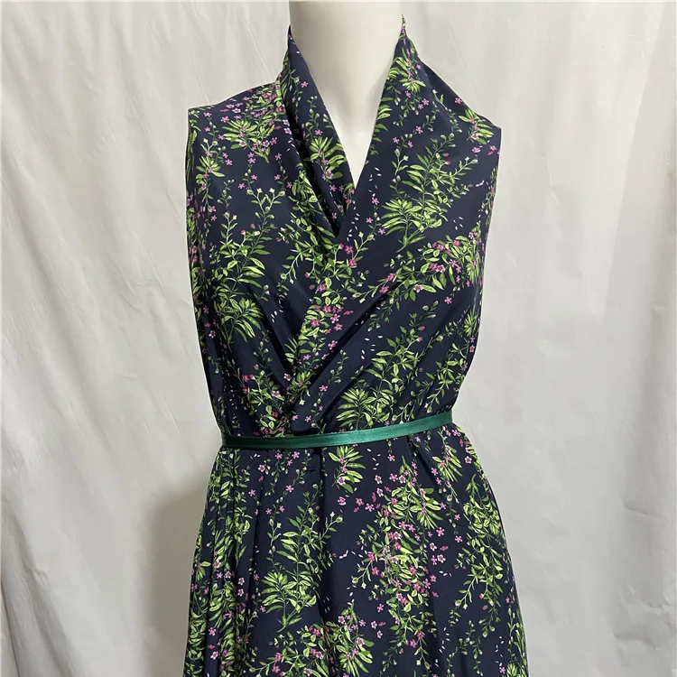 Pure silk crepe de chine fabric green leaves and floral print on navy blue bottom,SCDC1231