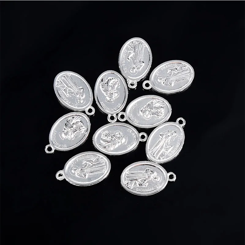 A variety of religious Christ small pendants, Lourdes small pendants, Saint Francis small pendants, Saint Michael small pendants