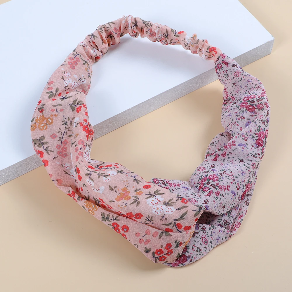 

Women's fashion all match with twisted pink floral hairband on top of the head women's elastic hair ring
