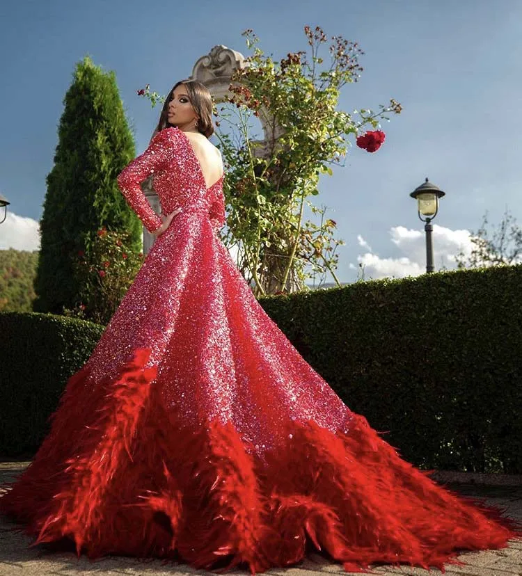 Sexy Red Bling Glitter Fabric profondo scollo A V manica lunga Low Back Shine A Line Feather Evening Dress