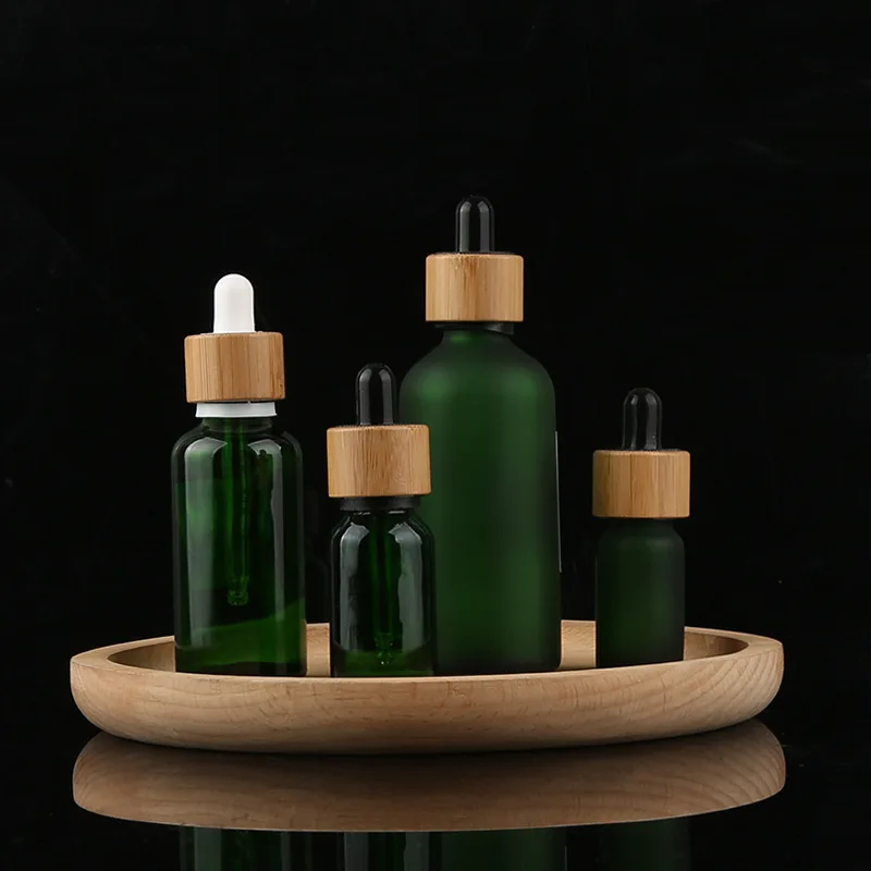 

Colorful Glass Bottles For Skin Care Essential Oil Dropper Bottle Can Silk Screen And Stick Label With Bamboo Dropper Lid Bottle