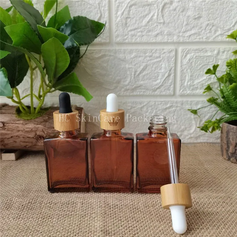 

Natural Bamboo Amber Cosmetic Packaging bamboo essential oil perfume Bottles 1oz Bottle with Bamboo Wrapped Dropper