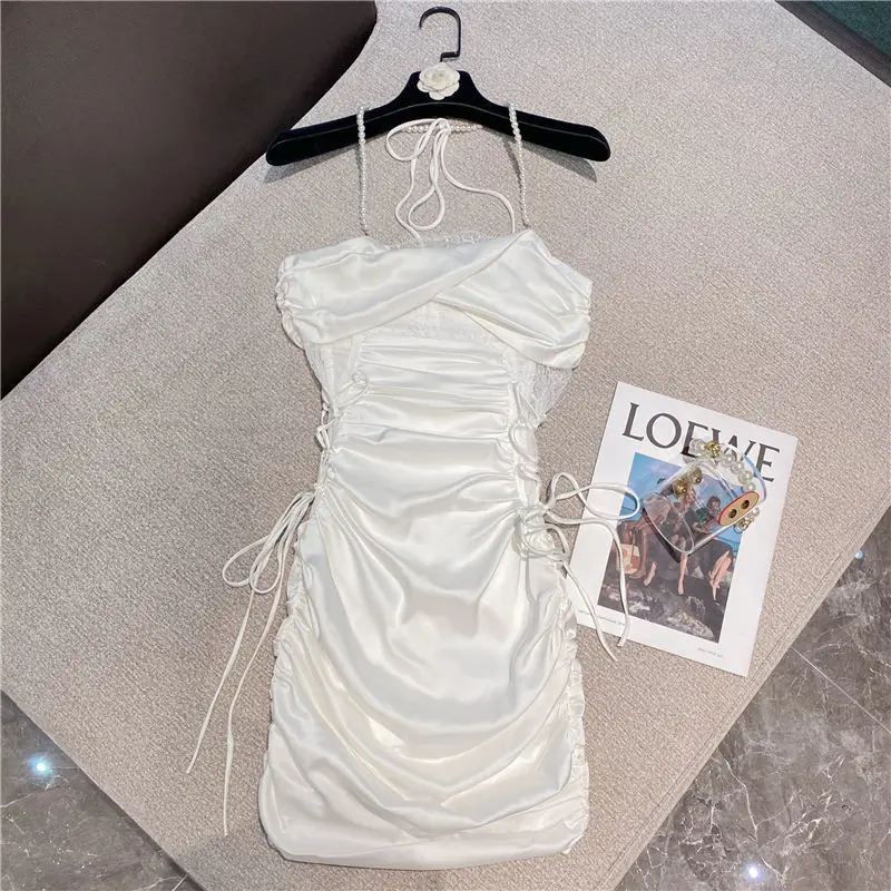 

2021 summer new pure lust sexy suspender dress women's high-grade pearly bilateral bandage waist slim pearl hanging neck skirt