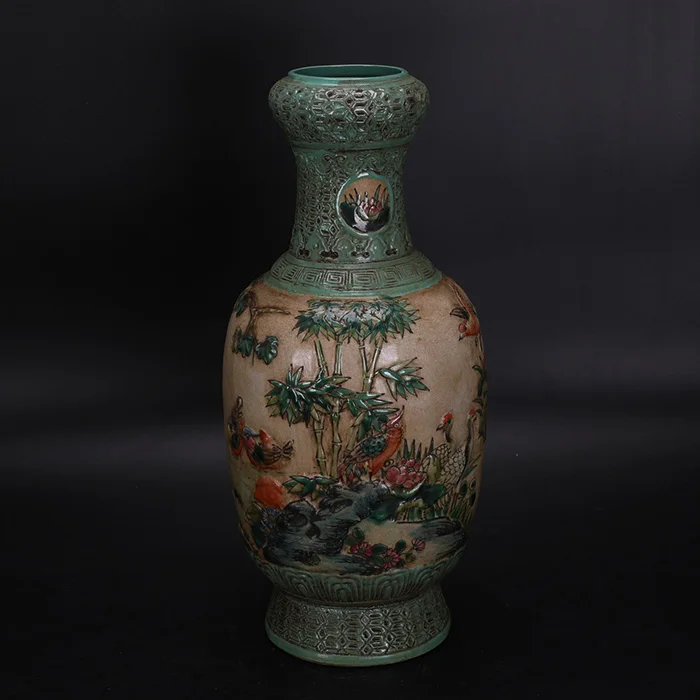 Qing Dynasty Qianlong embossed famille rose flower and bird design garlic bottle