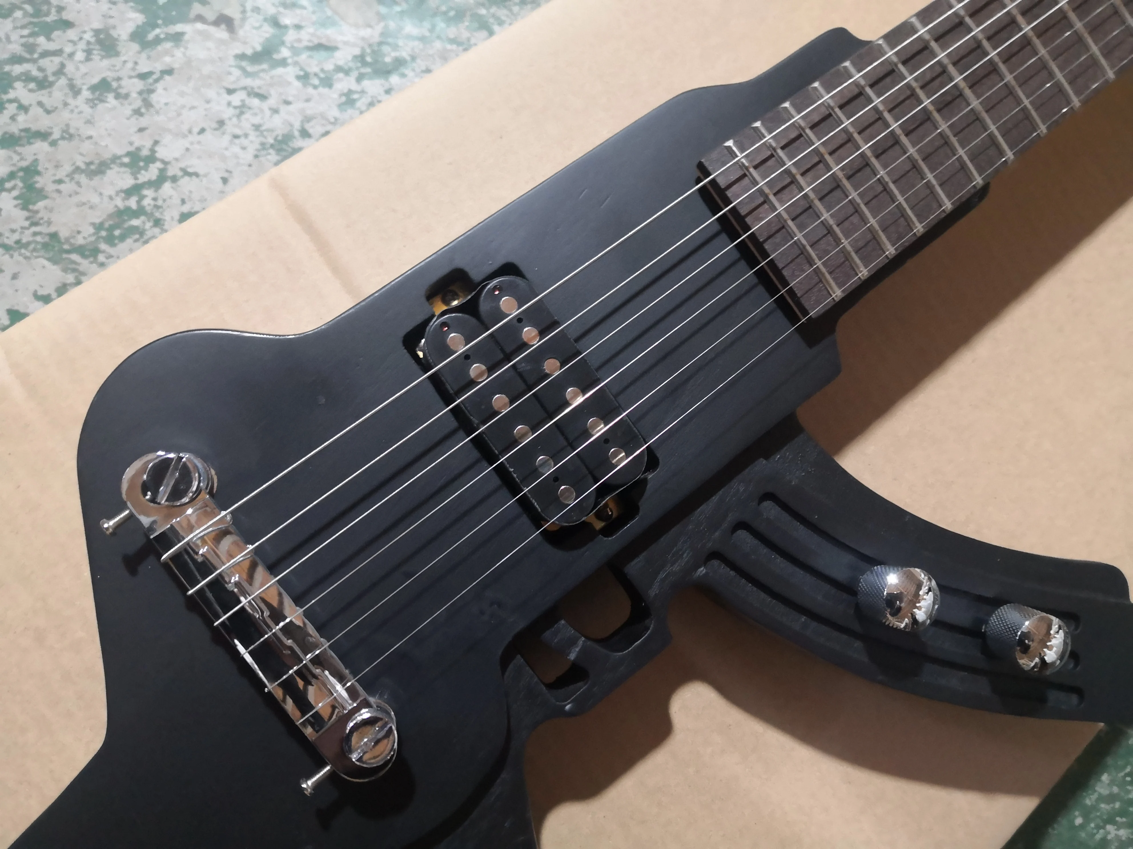 custom Gun guitar 6 string guitar,irregular metal black guitar,fixed bridge H pickups,black button,