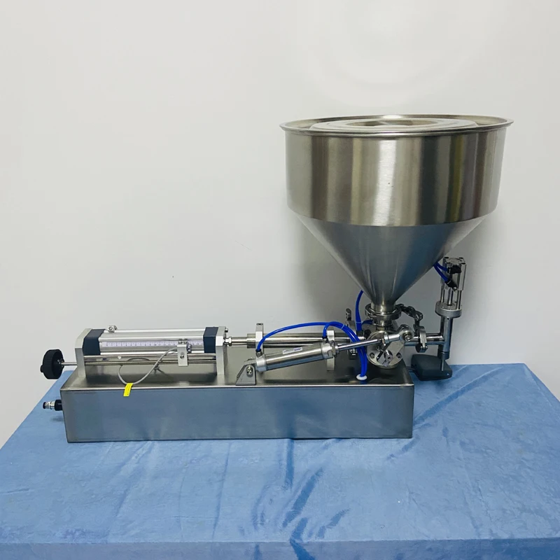 Pequeña máquina neumática de llenado de pasta de un solo cabezal, máquina de llenado eléctrica de productos para el cuidado de la piel, salsa de pasta de propóleo