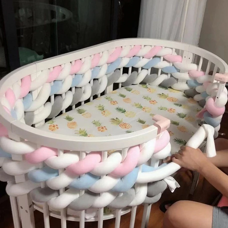 The Baby Bumper Bed iswound with woven Braid Knot Pillow Cushion Bumper for Infant Bebe Crib Protector Cot Bumper Room Decor