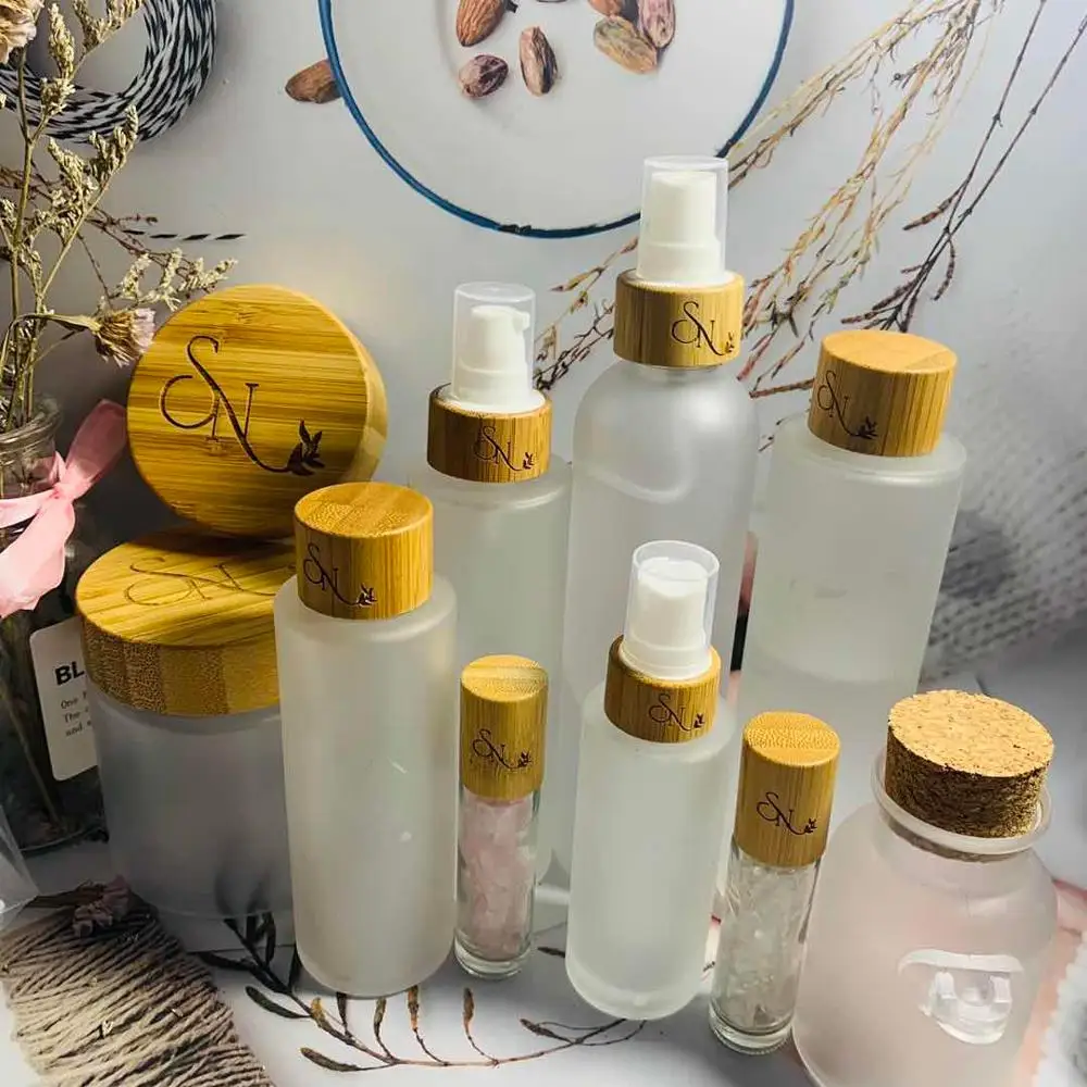 

spray bottles wholesale 100ml transparent frosted glass bottle Environmental bamboo lid glass bottles empty cosmetic containers