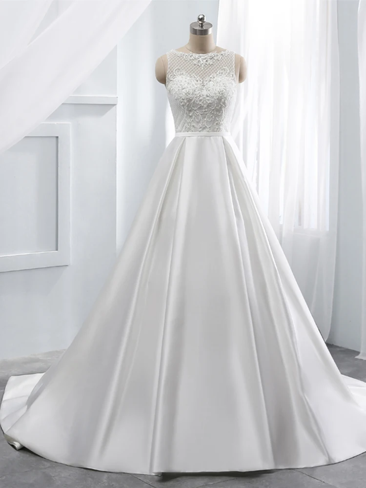 Robe de mariée trapèze en Satin moderne, personnalisée, avec des cristaux et des Appliques de perles, effet d'illusion, col rond, sans manches