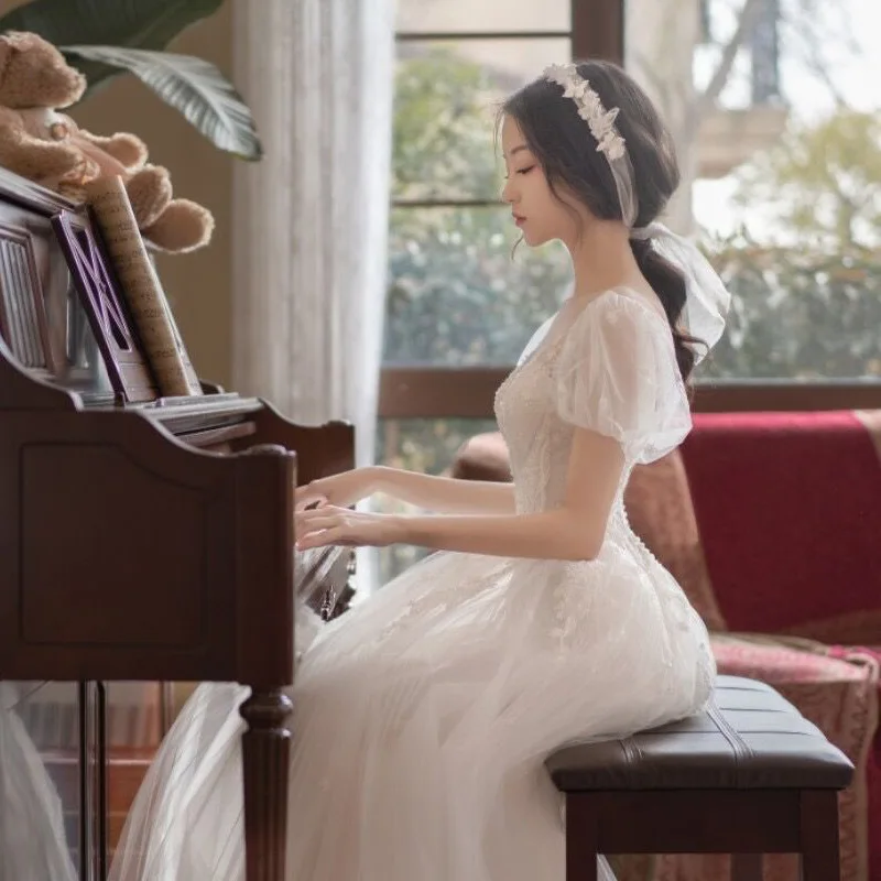 Vestido de casamento retrô em estilo francês, vestido longo de princesa, costas nuas e gola redonda, manga curta de tule