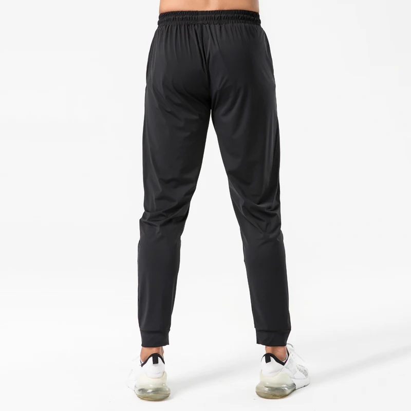 Pantalones de chándal elásticos para hombre, pantalones largos ajustados de secado rápido para gimnasio y entrenamiento