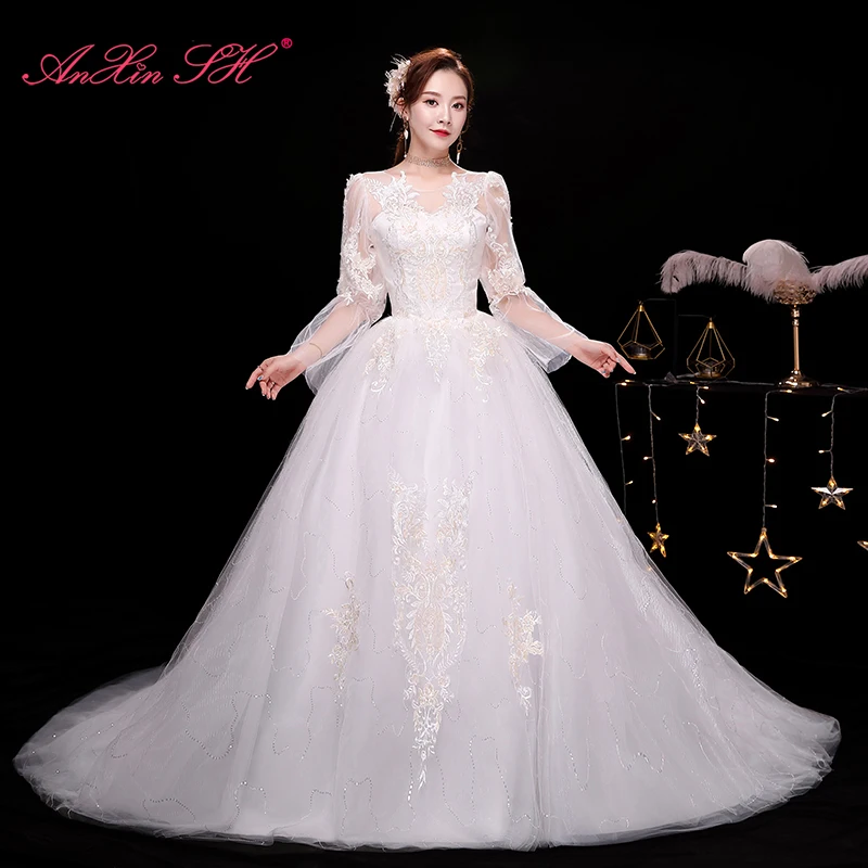 

AnXin SH princess flower lace white wedding dress party vintage o neck long flare sleeve white train lace up wedding dress