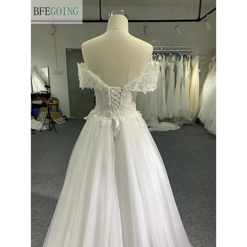 Vestidos de novia de encaje de marfil, vestidos de novia de línea a, longitud hasta el suelo, con cuentas y hombros descubiertos, con forma de corona Tran, con escote Corazón, hechos a medida