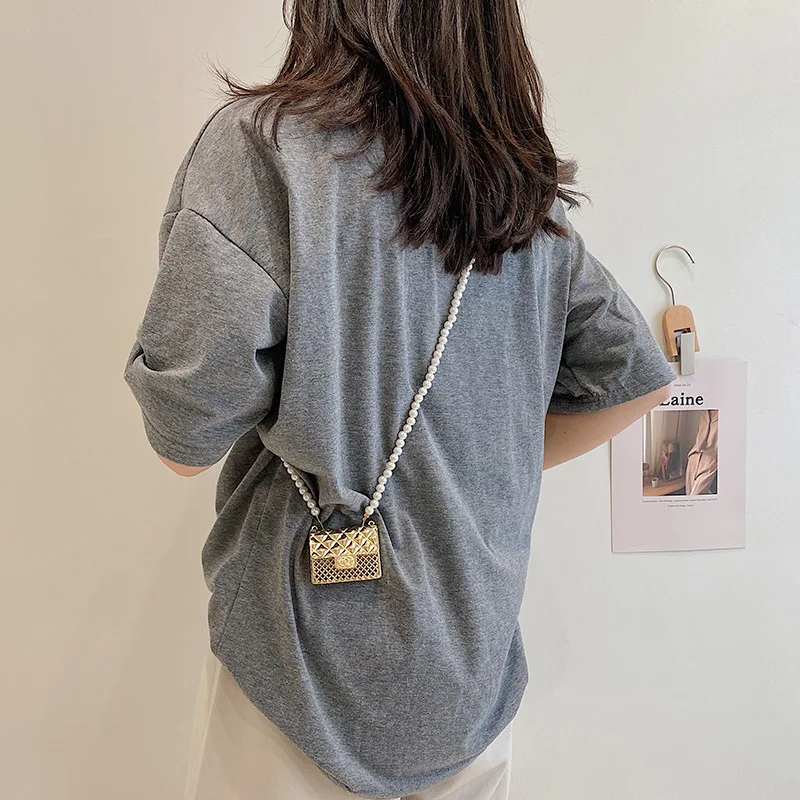 Sacs à bandoulière d'été en métal creux pour femmes, 2021, nouveau Mini petit sac à chaîne de perles, mode fête marque de luxe sac à bandoulière pour dames