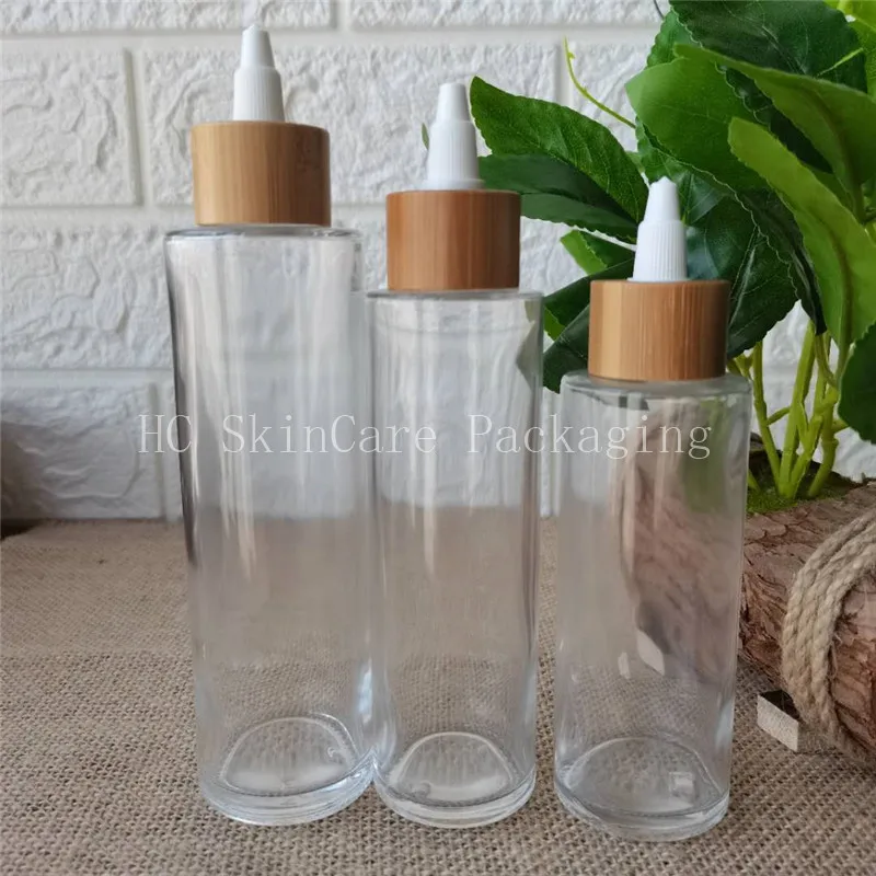 Wholesale Cosmetic Packaging 100ml 120ml 150ml Round Clear Empty Lotion Foundation Glass Bottle with pump spray