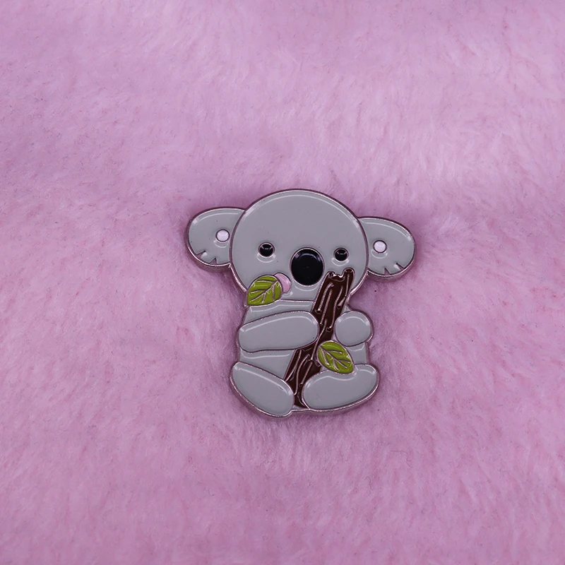 Sleepy Bear Pin This cute little koala, munching on native Australian eucalyptus leaves