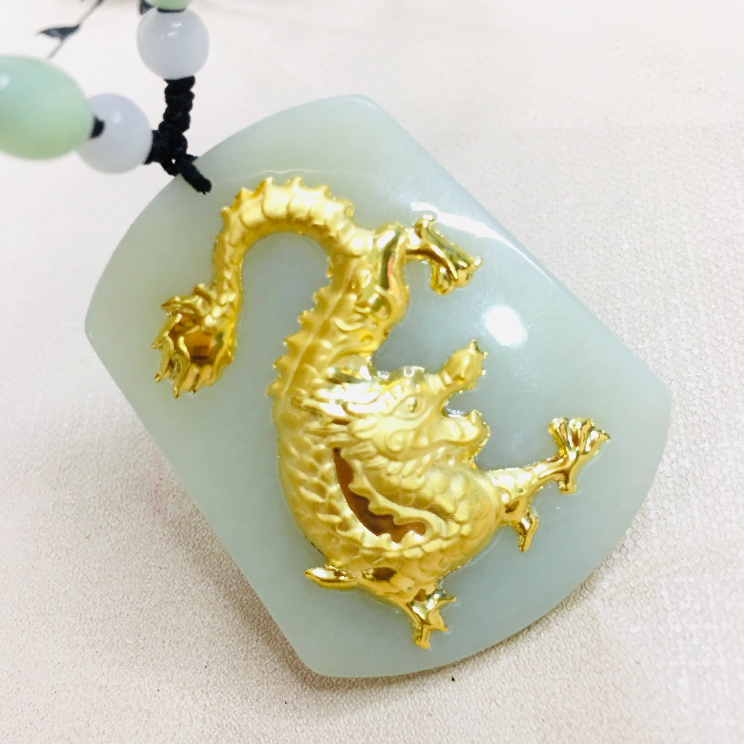 

Zheru Jewelry Pure natural Hetian jade inlaid 24K gold large flying dragon pendant necklace Exquisite gold inlaid jade Send cert