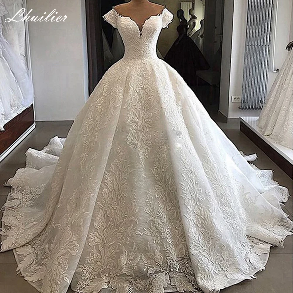 

Lhuilier Customized Ball Gown Lace Wedding Dresses Floor Length V-neck Beaded Cap Sleeves Bridal Dress with Chapel Train