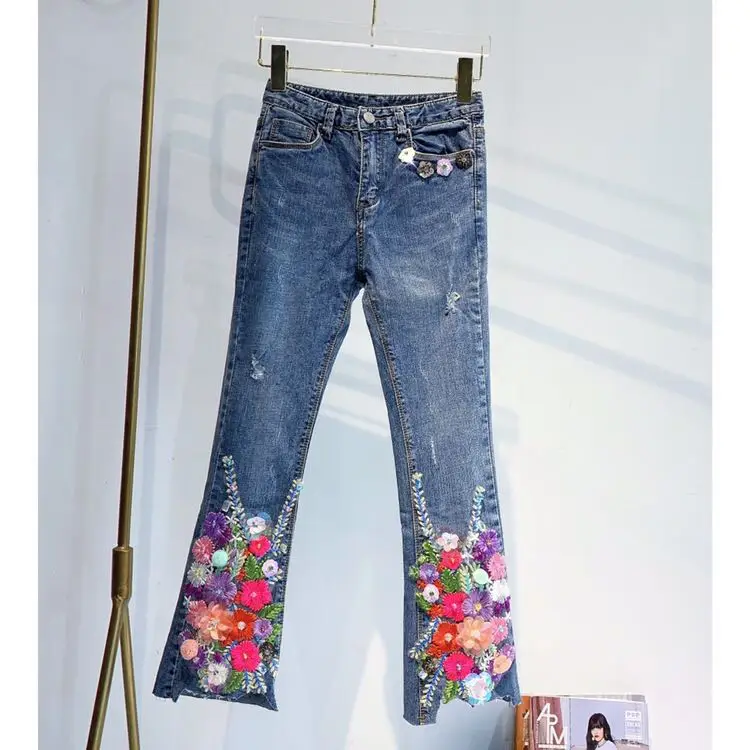 Jeans ricamati con strass per l'industria pesante jeans svasati elasticizzati con fiori a vita alta da donna