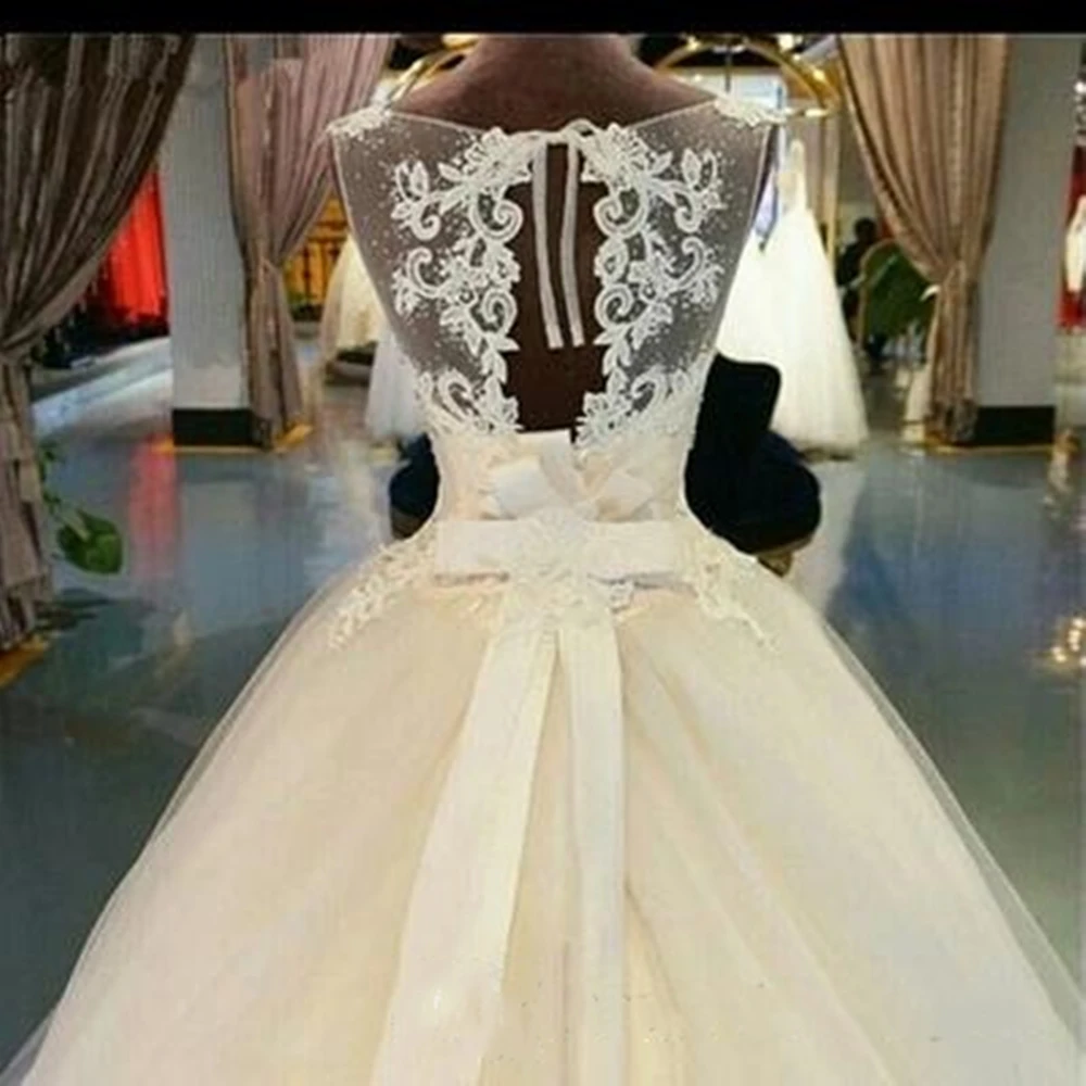 2020 hermosos vestidos de novia de tul sin mangas Línea A ilusión apliques para la línea de cuello elegante vestidos de novia a medida corte tren