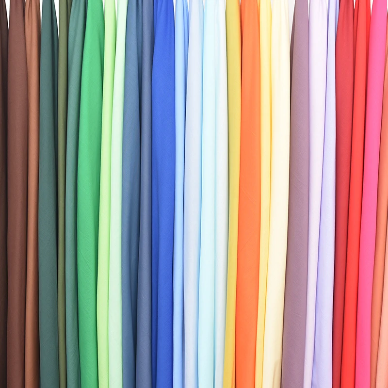 71 لونًا متوفرًا في المخزون قماش بطانة قطن خفيف عادي 100% نسيج فوال قطن قسط أقمشة قطنية نقية لملابس الأطفال