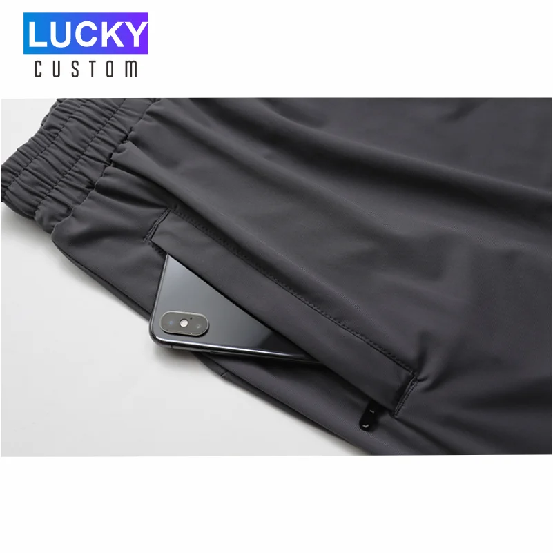 Pantaloncini sportivi da corsa ad asciugatura rapida da uomo pantaloni Casual in Nylon di seta di ghiaccio elasticizzato con Logo ricamato personalizzato 4xl