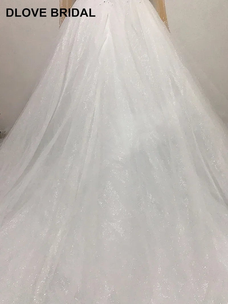 Robe de mariée luxueuse pour le bal à couches à manches longues avec jupe lourde et perlée, scintillante, sur mesure