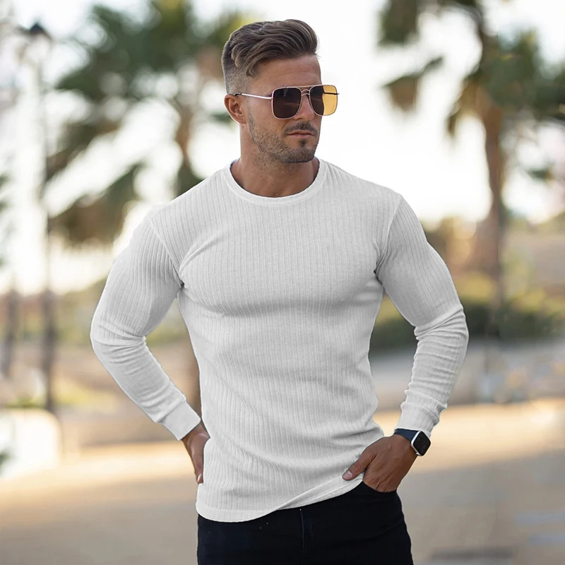 Suéteres de cuello redondo a la moda para hombre, jerseys de punto de tiras negras, suéter informal sólido, prendas de punto ajustadas para Otoño e