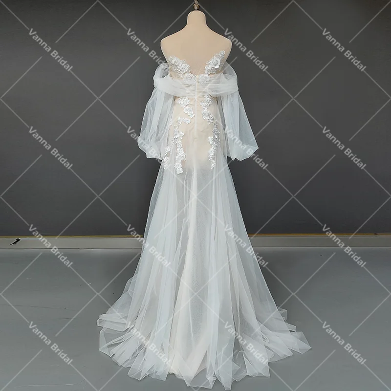 Spalle scoperte abito da sposa con applicazioni floreali 3D Criss Cross Tulle su misura una linea trasparente maniche lunghe A sbuffo abiti da sposa