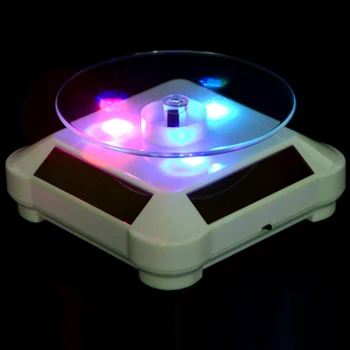 ソーラー/バッテリー回転ディスプレイスタンドターンテーブル led ライト宝石時計 360 度回転ディスプレイスタンド