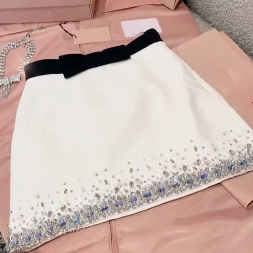 Spring and summer new crystal diamond skirt women high waist bow hit color A-line short skirt