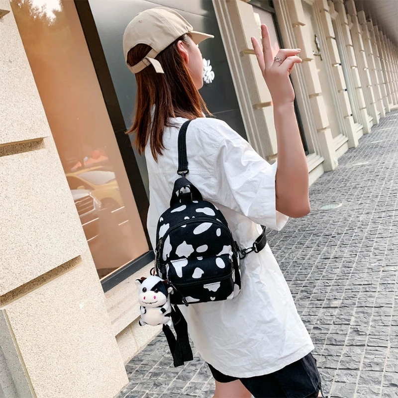 Mini Canvas Daypack with Plush Pendant Cow Print Backpack for Women Lady Girls Outdoor Travel Shopping