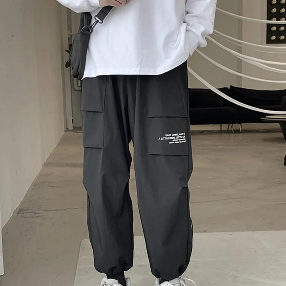 

Men Sporty Thin Sweatpants Multi Pockets Ankle Tied Long Pants Loose Trousers