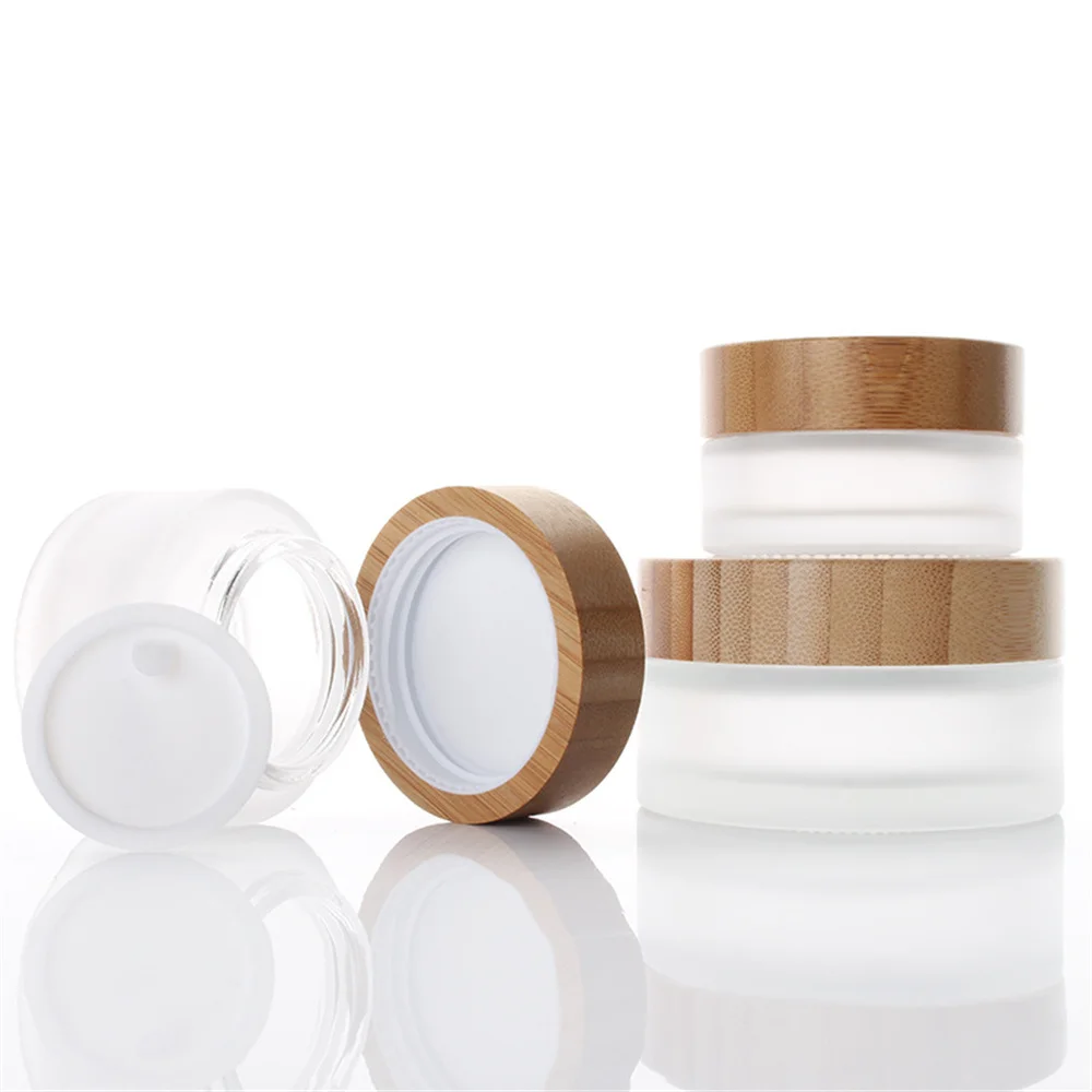 

Wholesale Custom Logo Matte Glass Container Bottle Frosted Pot For Cosmetics Serum Face Eye Cream Jar With Bamboo Lid