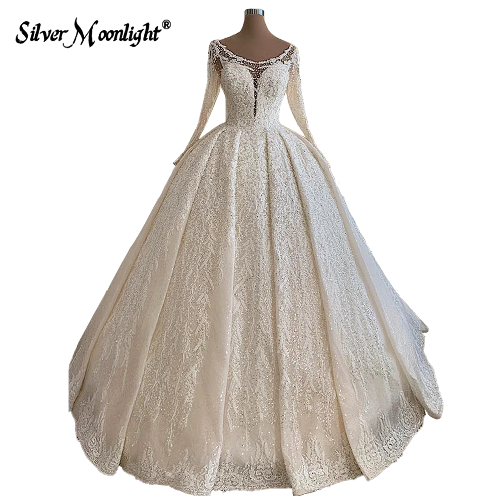 Vestidos de novia de encaje de línea A de manga larga con perlas, elegante cuello redondo, apliques de cuentas completas, tren de corte, vestido de novia Vintage árabe