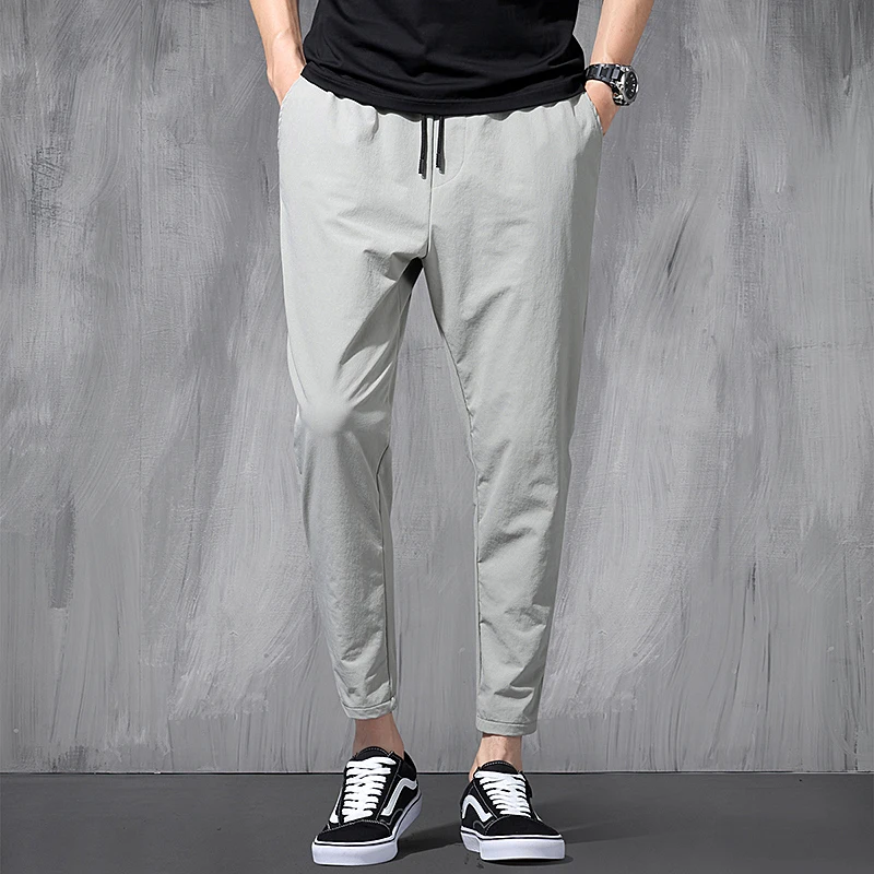 2024 New Korean Ice Silk Elastic Trousers Four Seasons Thin Casual Men\'S Loose 9-Point Large Size Small Foot Sports Pants Spring